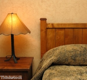 The simple lines of Mission wood furniture is often accompanied by auburn glass lamps.