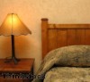 The simple lines of Mission wood furniture is often accompanied by auburn glass lamps.